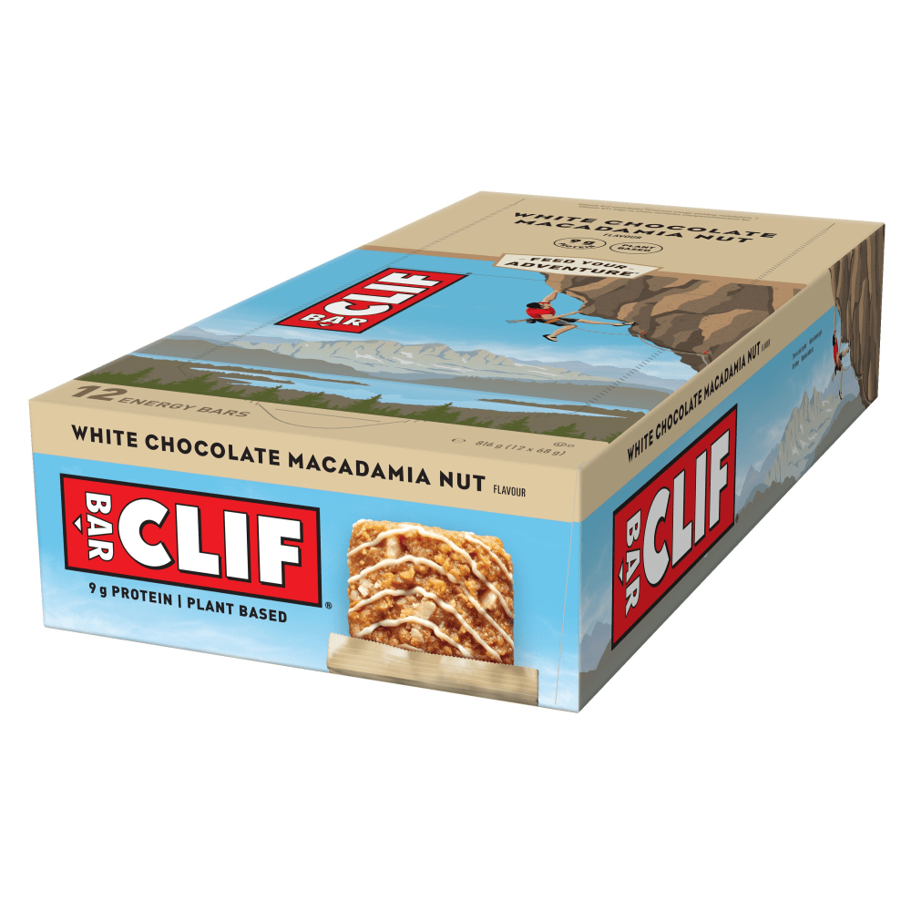 Clif Natural Energy Bar pack featuring 12 bars in White Chocolate Macadamia flavor, with a beige and brown box design and a climber graphic on the side.