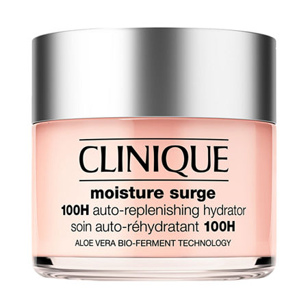 Clinique's Moisture Surge 100H Auto-replenishing Hydrator in a clear glass jar with a silver lid, featuring a pink cream inside and labeled with product details.