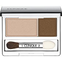 Clinique All About Shadow Duo features a compact with a light beige shade and a rich brown shade, accompanied by a dual-ended applicator brush.