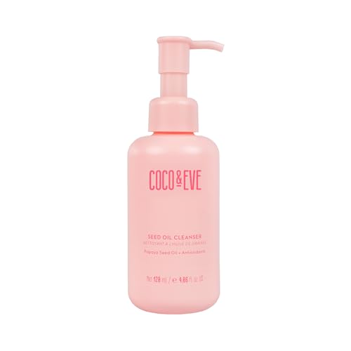 Light pink bottle with a pump dispenser, labeled "Coco & Eve Seed Oil Cleanser," featuring a sleek design and minimalist text, emphasizing its hydrating and restorative properties.