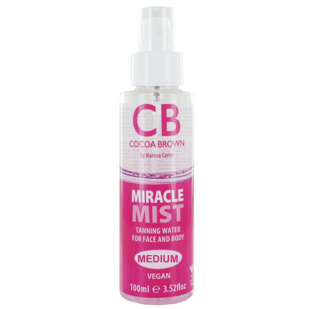 Clear spray bottle with a pink label featuring "Cocoa Brown Miracle Mist Tanning Water Medium" text, 100 ml size, and vegan certification, designed for face and body tanning.
