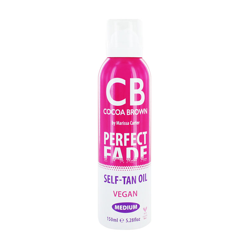 Cocoa Brown Perfect Fade Self Tan Oil in a sleek pink and white bottle, featuring bold text, vegan label, and 150ml capacity, designed for gradual tanning and instant bronzing.