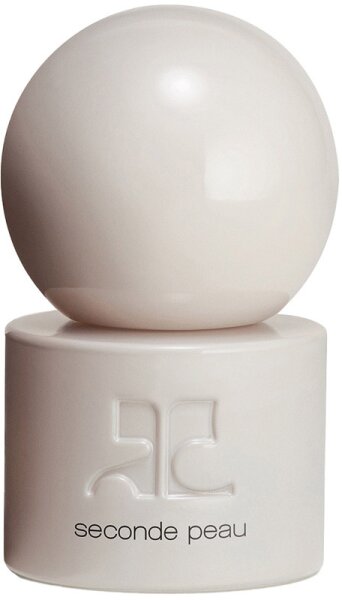 A sleek, minimalist perfume bottle featuring a round, white cap and a cylindrical base with the embossed text "seconde peau" in a modern font.