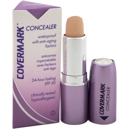 Covermark Waterproof Concealer in a 1.6g stick, featuring a light beige shade, housed in a sleek purple tube with a silver cap, labeled with SPF 30 and anti-aging benefits.
