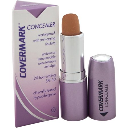 Covermark Waterproof Concealer in shade 5, featuring a sleek silver and lavender tube, with a twist-up applicator and a protective cap, promises 24-hour wear and SPF 30.