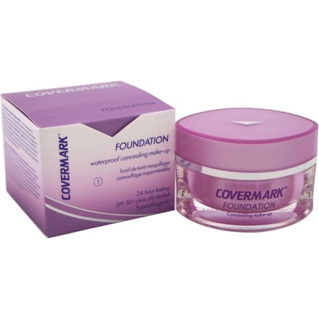 Purple jar of Covermark Foundation with a clear base, featuring a pink lid, accompanied by a matching purple box, labeled with product details and SPF 30.
