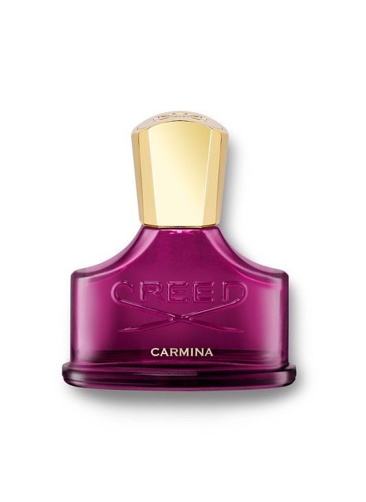 Purple glass bottle of Creed Carmina Eau De Parfum, featuring a gold cap and embossed logo, highlighting the sensuous Rose De Mai fragrance.