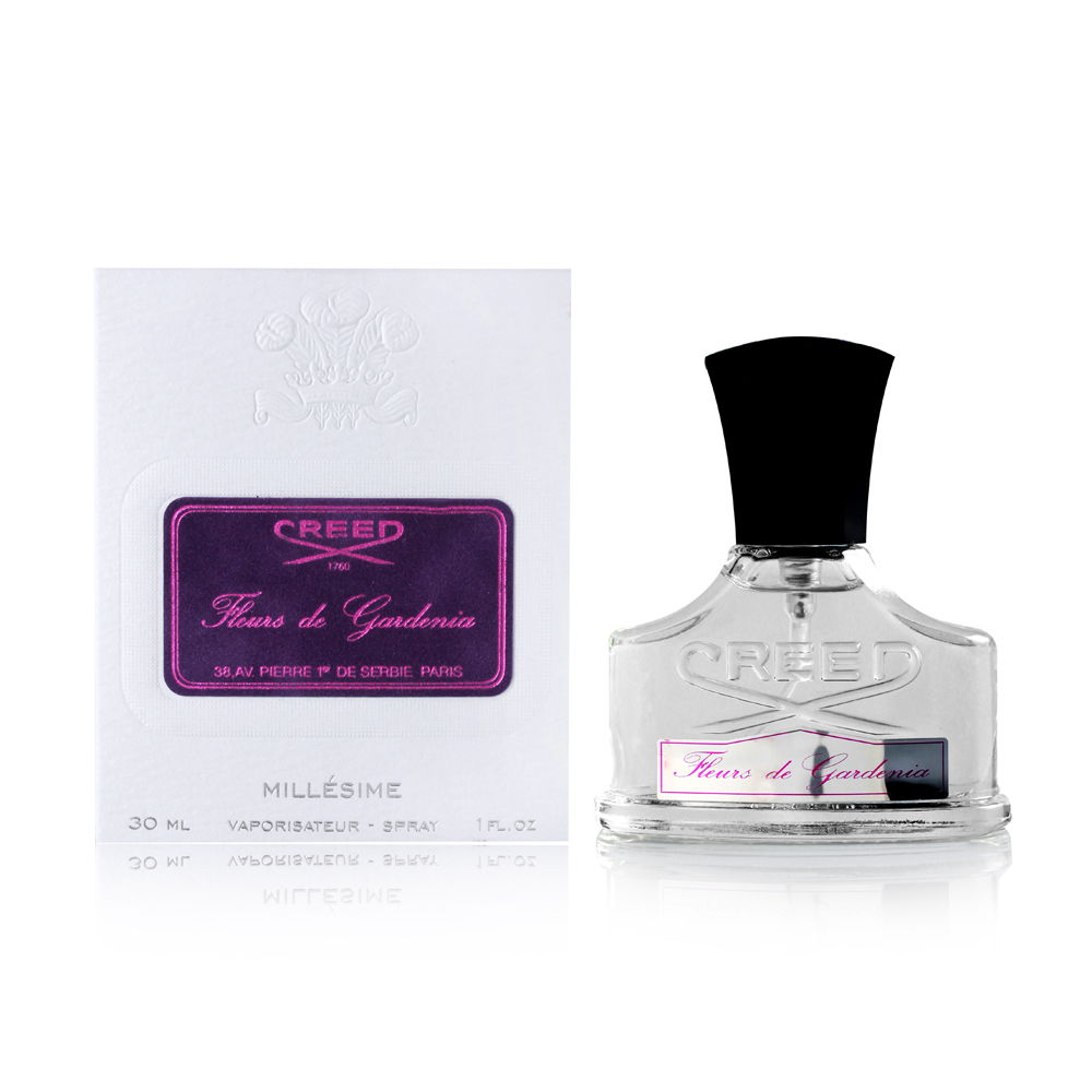Clear glass bottle with a black cap, featuring a decorative label in purple and white, alongside a white box with a matching purple label for Creed Fleurs De Gardenia Eau De Parfum.