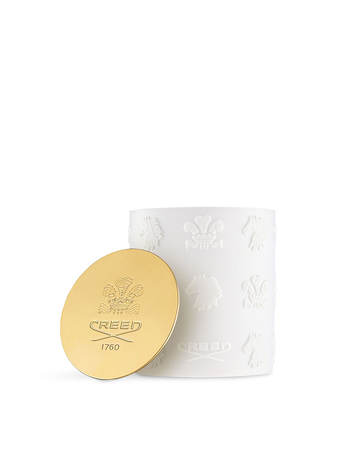 White ceramic candle with embossed CREED logo and gold lid, featuring a textured design and elegant branding, exuding a luxurious aesthetic.
