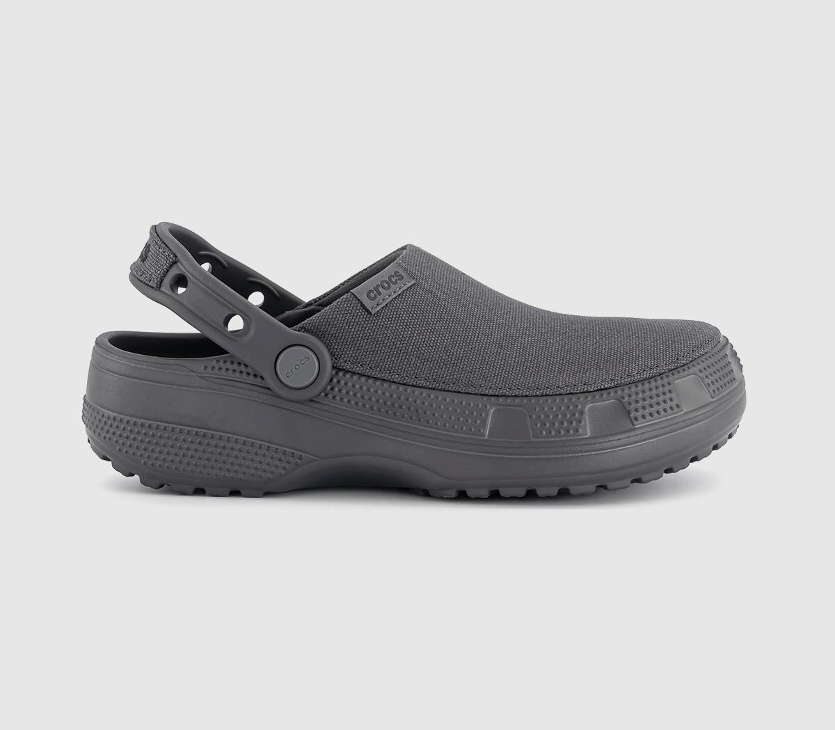 Gray unisex Crocs Crafted Classic Clog made of durable material, featuring a textured upper, adjustable strap, and a rugged sole for comfort and support.