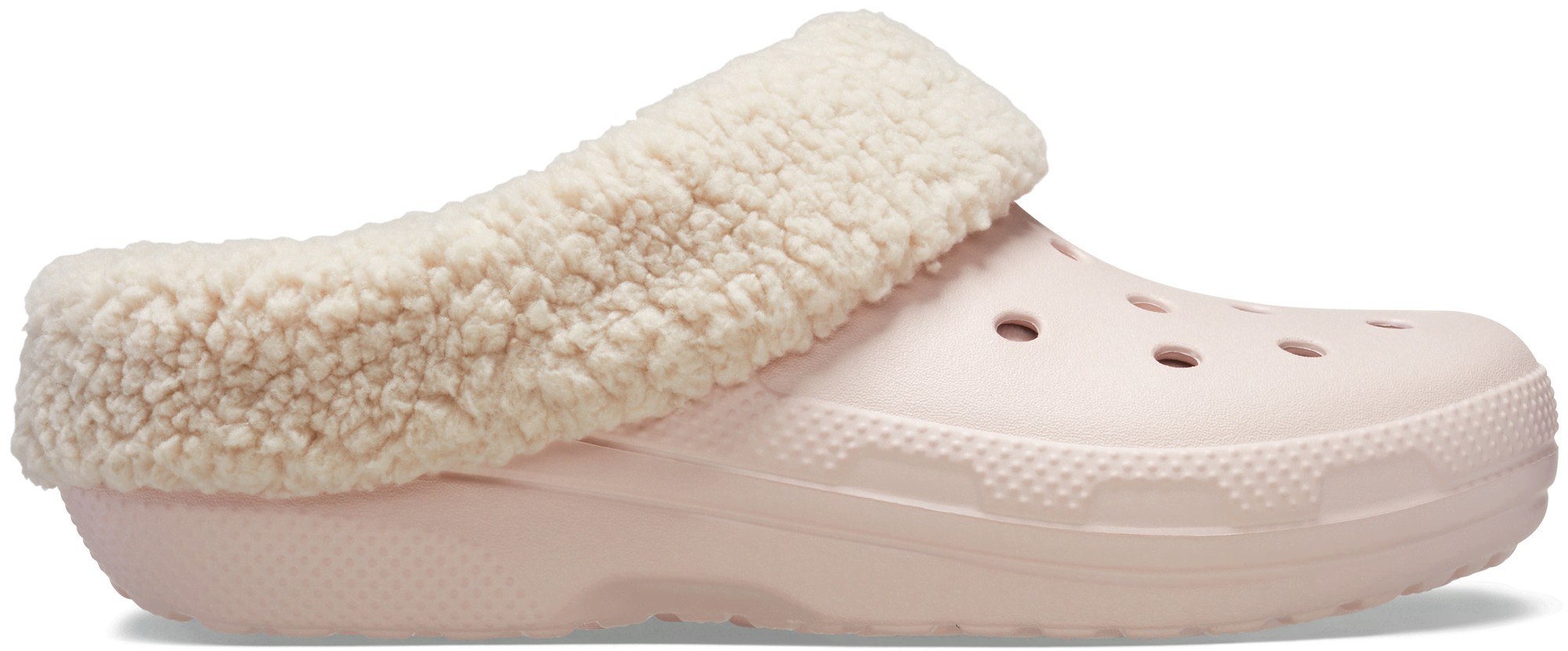 Pale pink Crocs Classic Blitzen IV Clog featuring a soft, cream-colored fleece lining and ventilation holes for breathability.