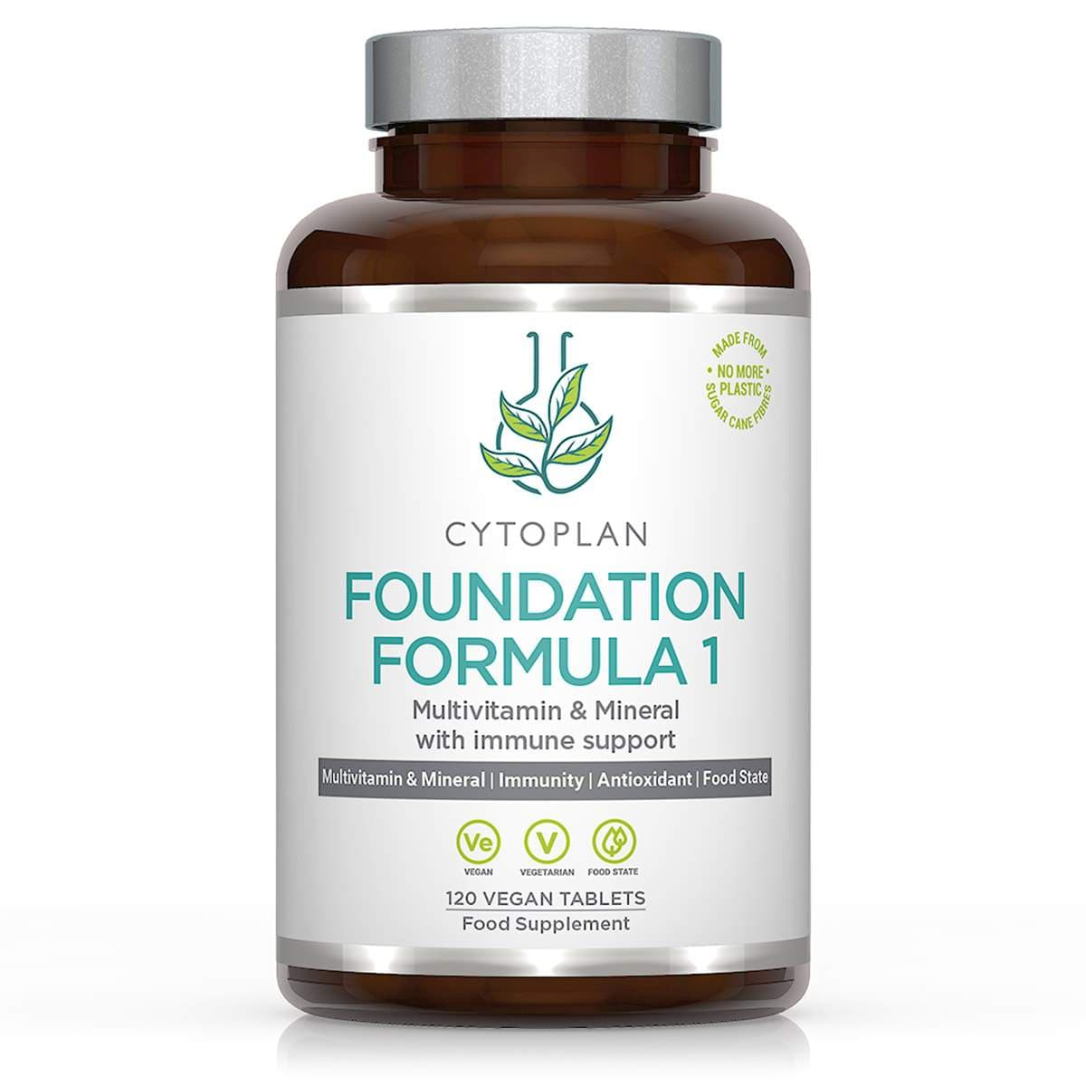 Brown glass bottle with a silver lid, labeled "Cytoplan Foundation Formula 1," containing 120 vegan tablets for multivitamin and mineral support, featuring green leaf graphics.