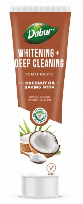 White toothpaste tube with a brown cap, featuring a coconut graphic and green leaves, labeled "Whitening + Deep Cleaning" with "Dabur" prominently displayed.