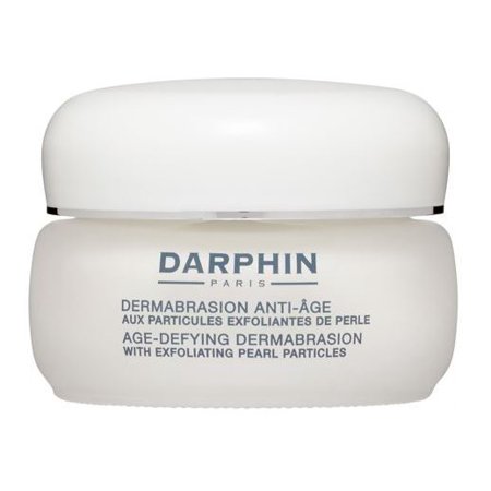 White jar with a smooth, rounded lid and a clear label featuring "Darphin" and product details in gray text, containing 50ml of age-defying dermabrasion cream.
