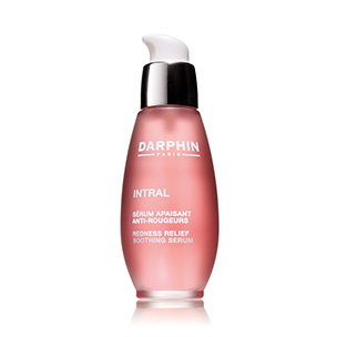 Darphin Intral Daily Rescue Serum in a sleek, pink glass bottle with a white pump top, labeled for redness relief and soothing, 50ml/1.7oz.
