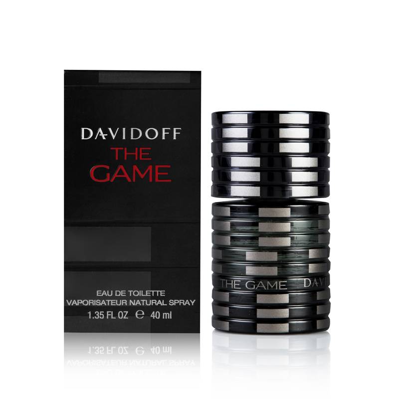 Black and silver cylindrical bottle with a textured design, featuring "THE GAME" and "DAVIDOFF" embossed, alongside a sleek black box with red lettering.