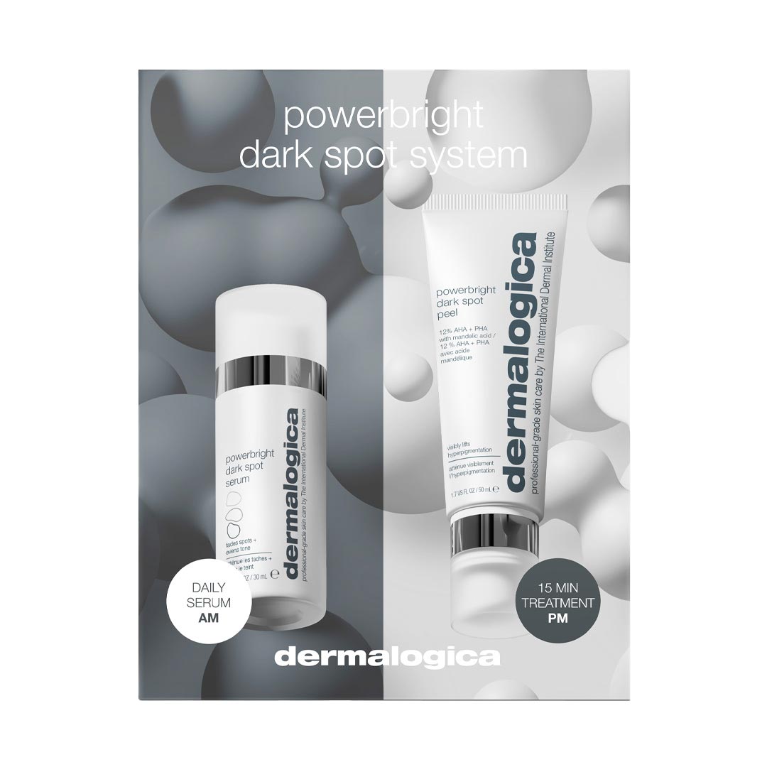 Dermalogica PowerBright Dark Spot System includes a sleek white serum bottle and a silver tube of treatment, both featuring the brand name prominently on a light gray background.