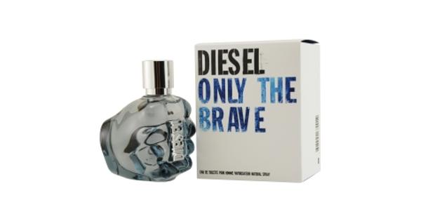 Clear glass bottle shaped like a clenched fist, with a metallic silver cap, accompanied by a white box featuring bold blue text reading "DIESEL ONLY THE BRAVE."