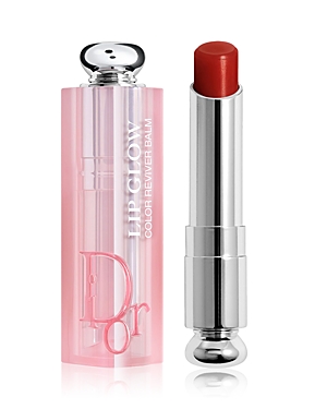 Dior Addict Lip Glow Reviving Lip Balm in a sleek silver and pink tube, featuring a shiny cap and a vibrant red balm, presented in a new box.