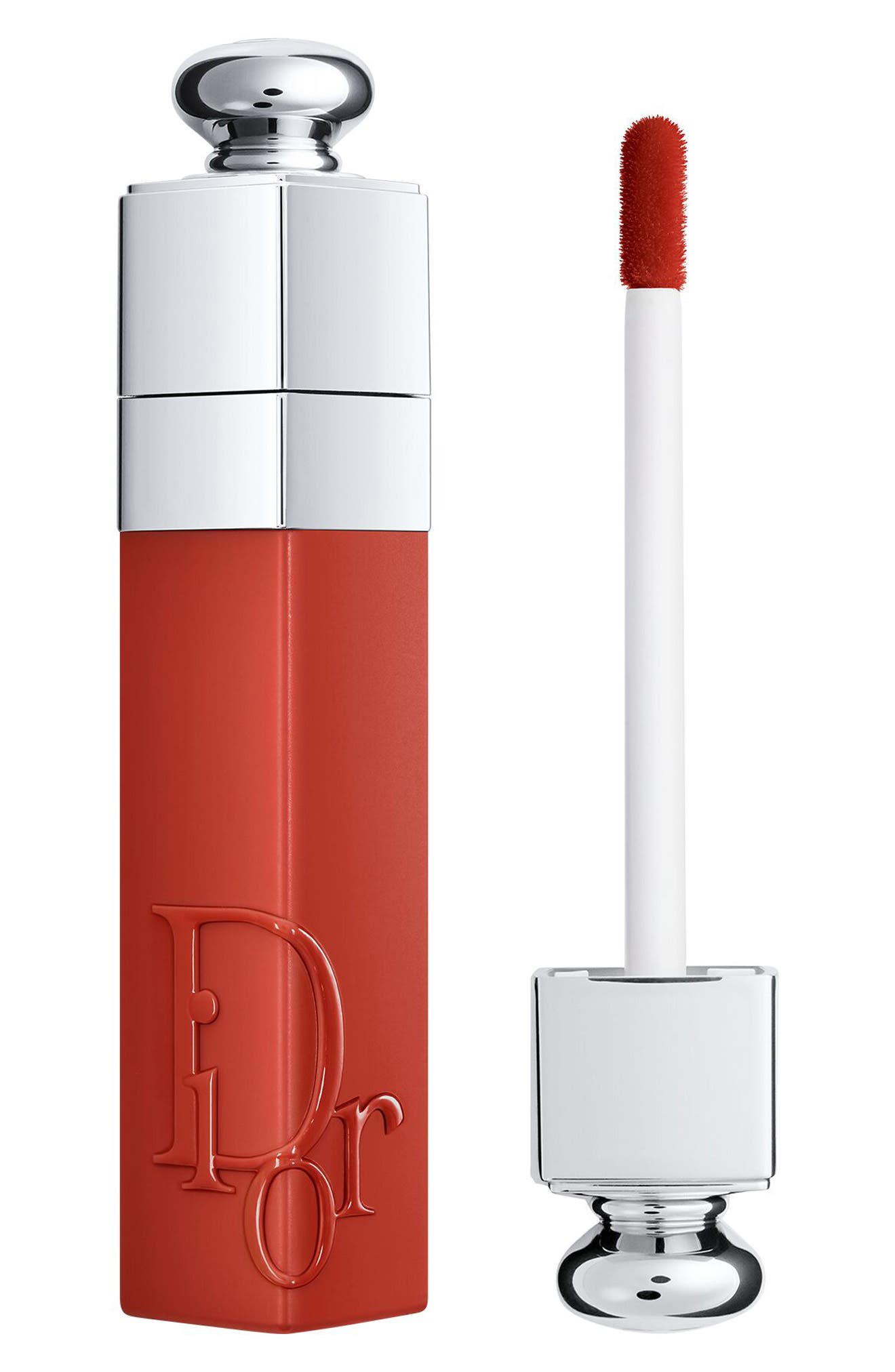 Dior Addict Lip Tint in shade 421 Natural Tea, featuring a sleek red-orange tube with a silver cap and a white applicator wand for precise application.