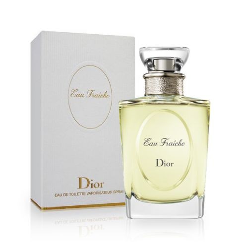 Clear glass bottle with a round shape, filled with pale yellow fragrance, topped with a silver cap; presented in a white box with gold accents and the name "Dior" prominently displayed.