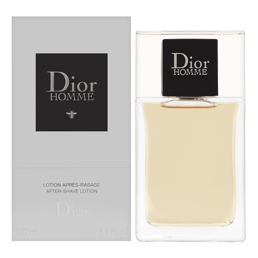 Clear glass bottle with a square shape, featuring a black label with "Dior Homme" in silver text, alongside a sleek gray box, both containing 100ml of aftershave lotion.