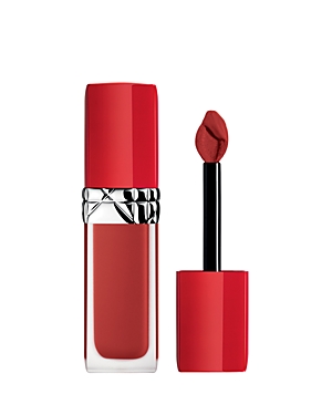 Bright red liquid lipstick in a sleek, transparent tube with a silver band, accompanied by a doe-foot applicator, labeled "635 Ecstase" by Christian Dior.
