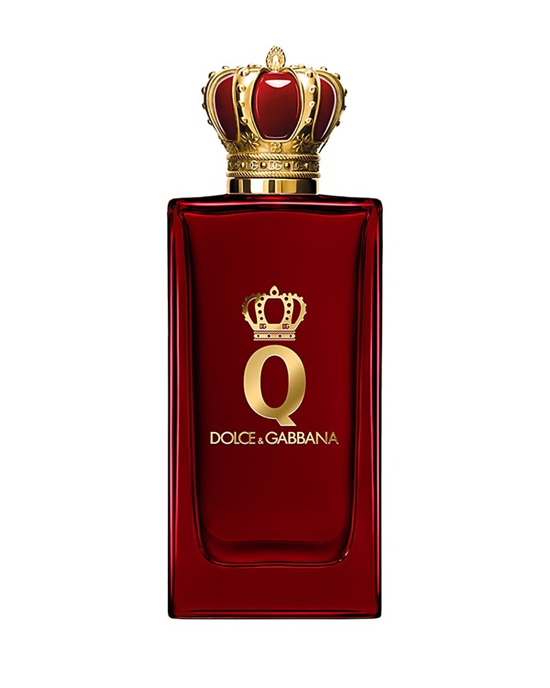 Red glass perfume bottle with a gold crown-shaped cap, featuring a prominent gold logo reading "Q DOLCE & GABBANA" on the front.