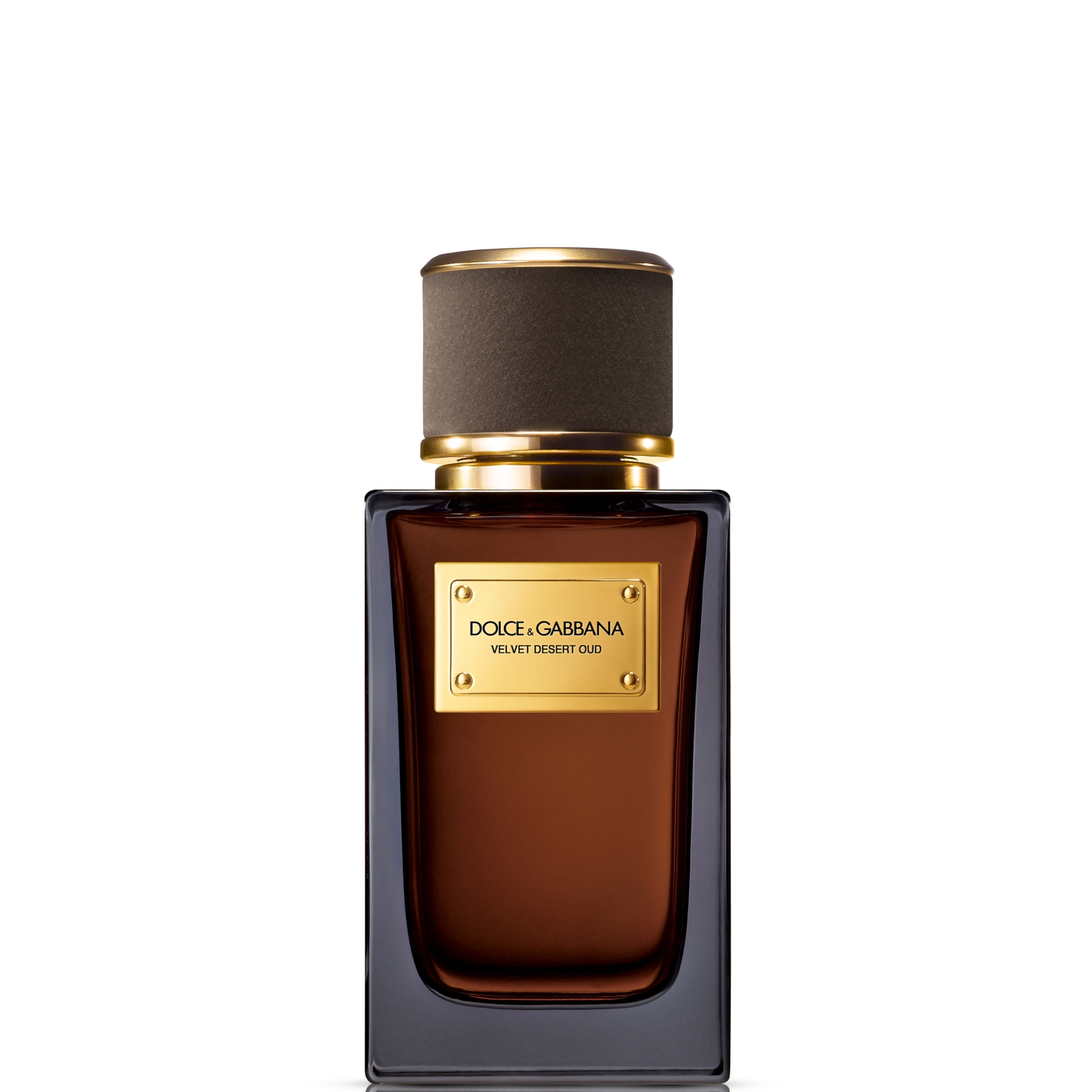 Elegant glass bottle of Dolce & Gabbana Velvet Desert Oud Eau de Parfum, featuring a rich amber hue, gold accents, and a dark brown cap, labeled with a gold plaque.