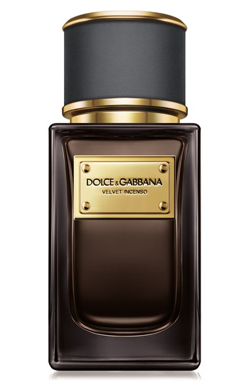Elegant dark glass bottle with a gold label reading "Dolce & Gabbana Velvet Incenso," topped with a matte black cap, showcasing a luxurious fragrance design.