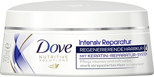 White round jar with a silver lid, labeled "Dove Intensive Repair Treatment Mask," featuring a blue and gold design, indicating a keratin repair system for damaged hair.