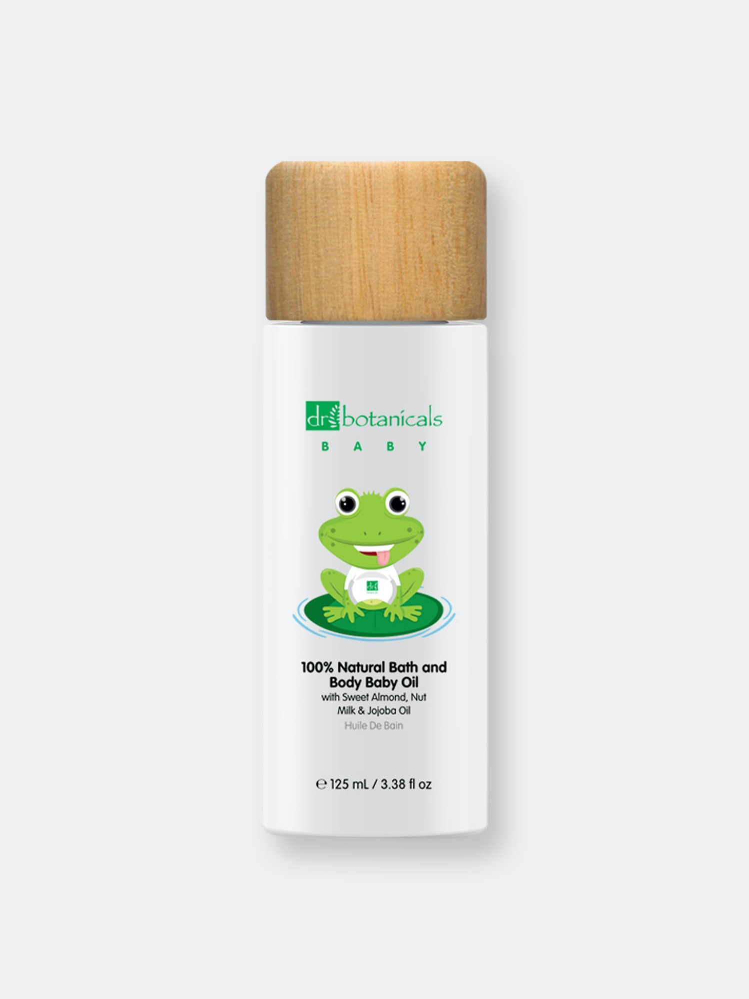 White bottle with a wooden cap featuring a cartoon frog, labeled "Dr Botanicals Baby 100% Natural Bath and Body Baby Oil" with jojoba and sweet almond oil, 125ML.