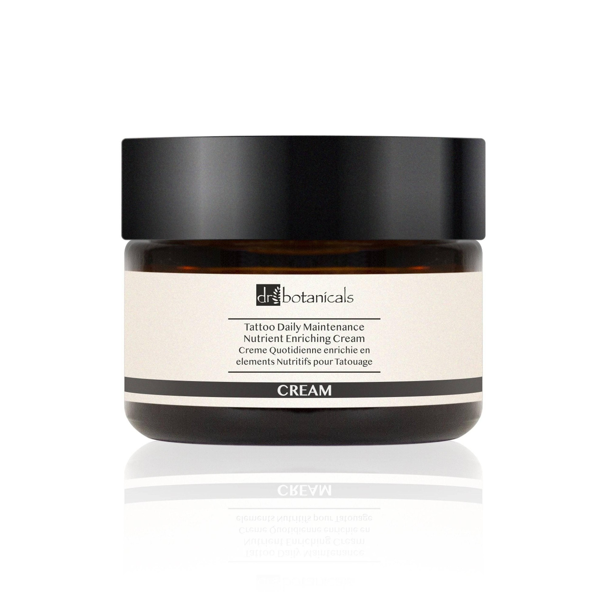 Dr. Botanicals Tattoo Balm in a 50ml amber glass jar with a black lid, featuring a white label with black text, designed for tattoo maintenance and nourishment.