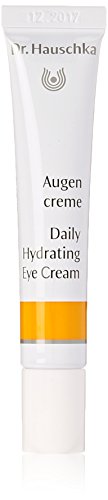 White tube with a yellow stripe, labeled "Daily Hydrating Eye Cream" in black text, featuring the Dr. Hauschka logo and a 12.5ml capacity.