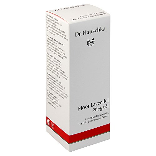 White cardboard box with red accents, featuring the Dr. Hauschka logo, labeled "Moor Lavender Calming Body Oil" in black text, indicating soothing and protective properties.