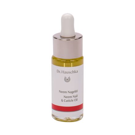 Clear glass bottle with a silver dropper cap, containing yellow neem oil for nails and cuticles, labeled "Dr. Hauschka Neem Nail & Cuticle Oil" with a red band at the bottom.