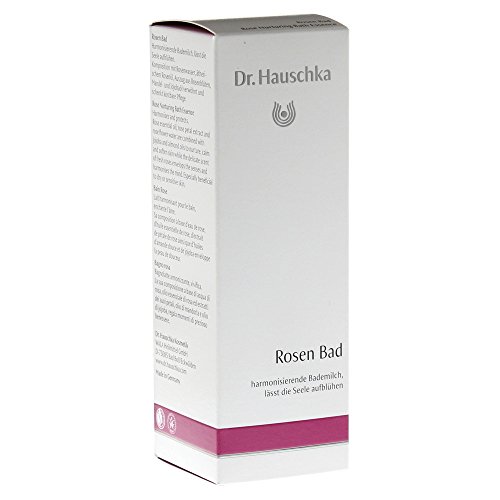 White box with pink accents featuring the Dr. Hauschka logo, labeled "Rosen Bad" and describing the product as a harmonizing bath essence, 100 ml.