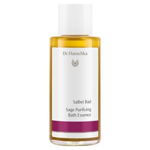 Clear bottle of Dr. Hauschka Sage Purifying Bath Essence, 100ml, featuring a white label with purple accents and a simple logo, containing a golden yellow liquid.