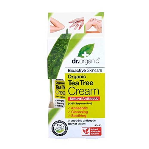 Green and white packaging featuring "Dr Organic Tea Tree Cream," highlighting its natural antiseptic properties and key ingredients like tea tree oil, with a 50ml size noted.