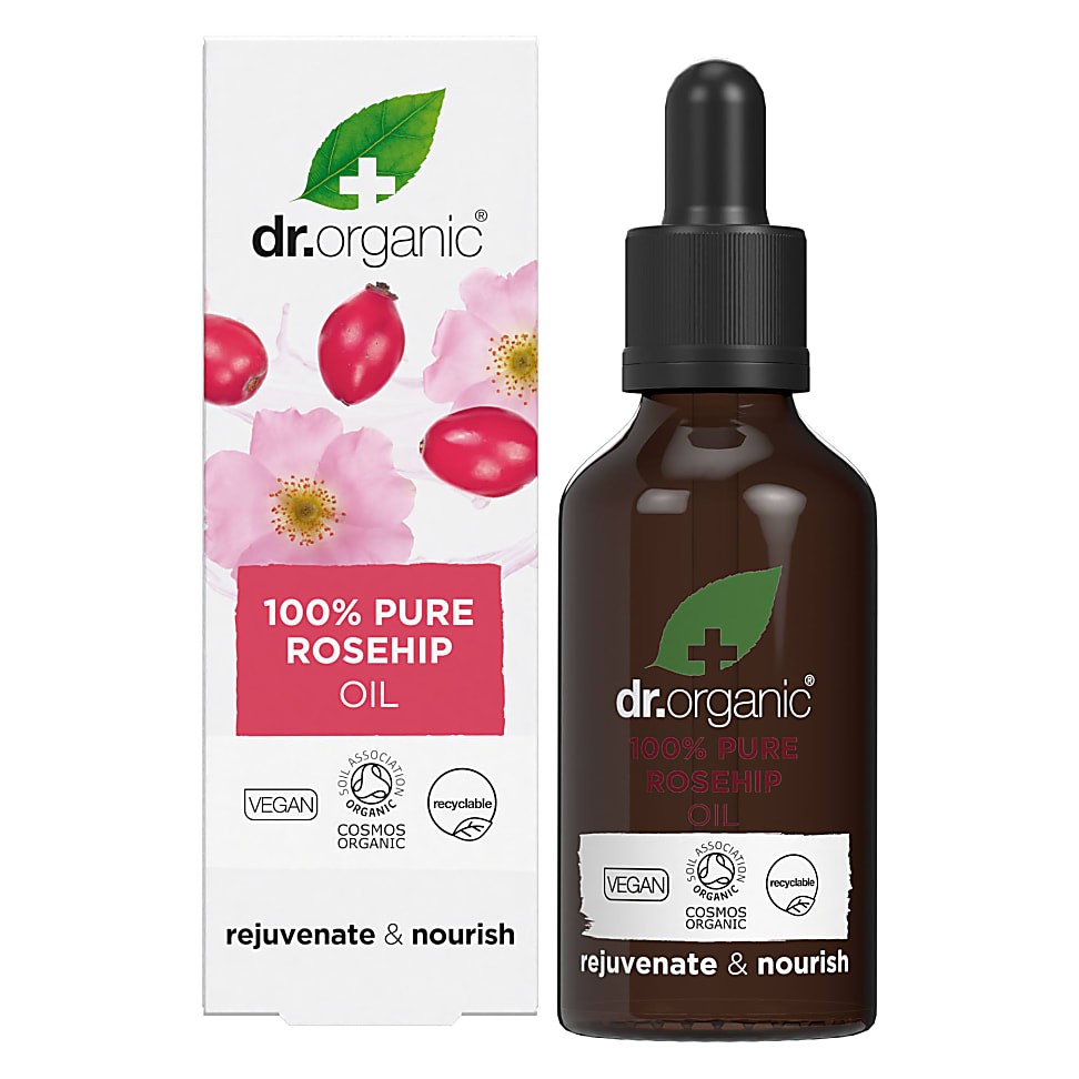 Brown glass dropper bottle of Dr Organic Rosehip Oil, featuring a black dropper cap and a white box adorned with pink flowers and red rosehips, labeled "100% Pure Rosehip Oil."