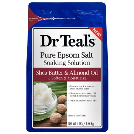 Blue packaging with a white label featuring "Dr Teal's Pure Epsom Salt Soak," highlighting shea butter and almond oil, with images of shea nuts and a bowl of cream.