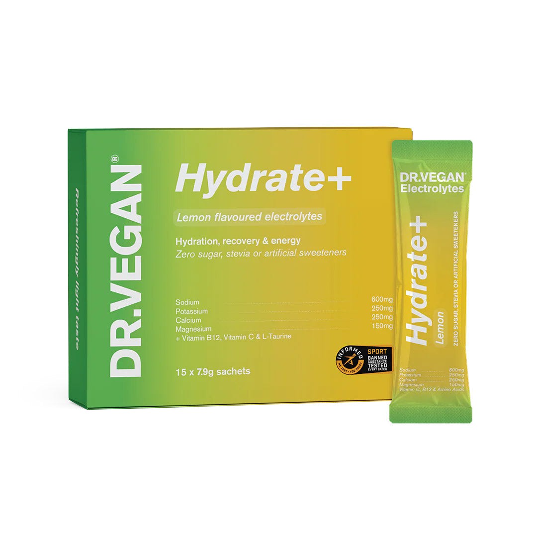 Bright green box labeled "DR. VEGAN Hydrate+ Lemon," containing 15 yellow sachets, highlighting electrolytes and key ingredients like sodium and vitamin B12.