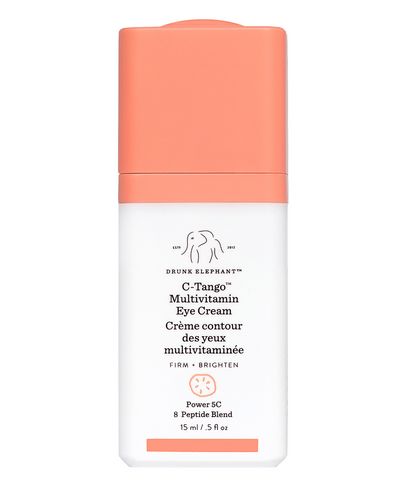 C-Tango Vitamin C Eye Cream by Drunk Elephant in a white and coral container, featuring a pump dispenser and text highlighting its multivitamin and peptide blend benefits.