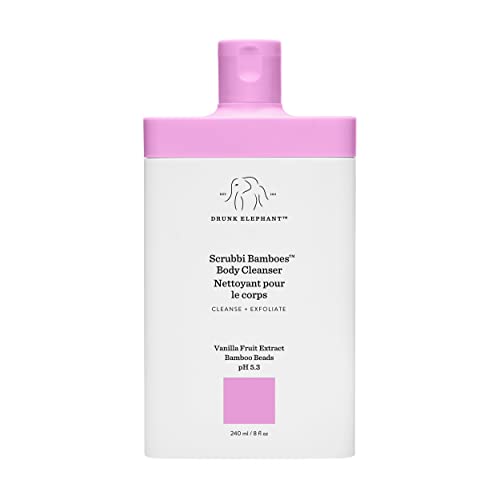 White bottle with a pink cap, labeled "Scrubbi Bamboes Body Cleanser" by Drunk Elephant, featuring a minimalist design and key ingredients like vanilla fruit extract and bamboo.