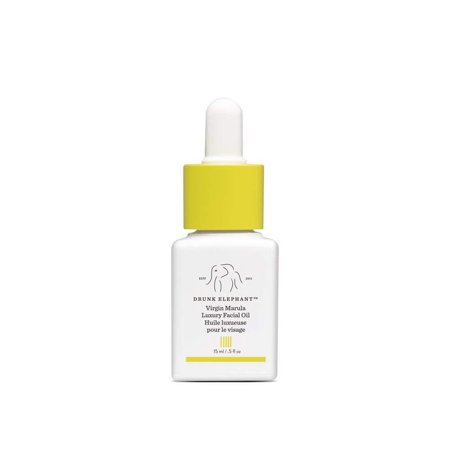 White glass bottle with a yellow dropper cap, labeled "Drunk Elephant Virgin Marula Luxury Facial Oil," 15 ML/.5 FL OZ, featuring a minimalist design and logo.