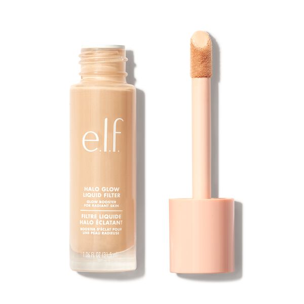 E.l.f. Halo Glow Liquid Filter in 0 Fair, a glass bottle with a light beige liquid, features a soft applicator wand and a pale pink cap, designed for enhancing skin radiance.