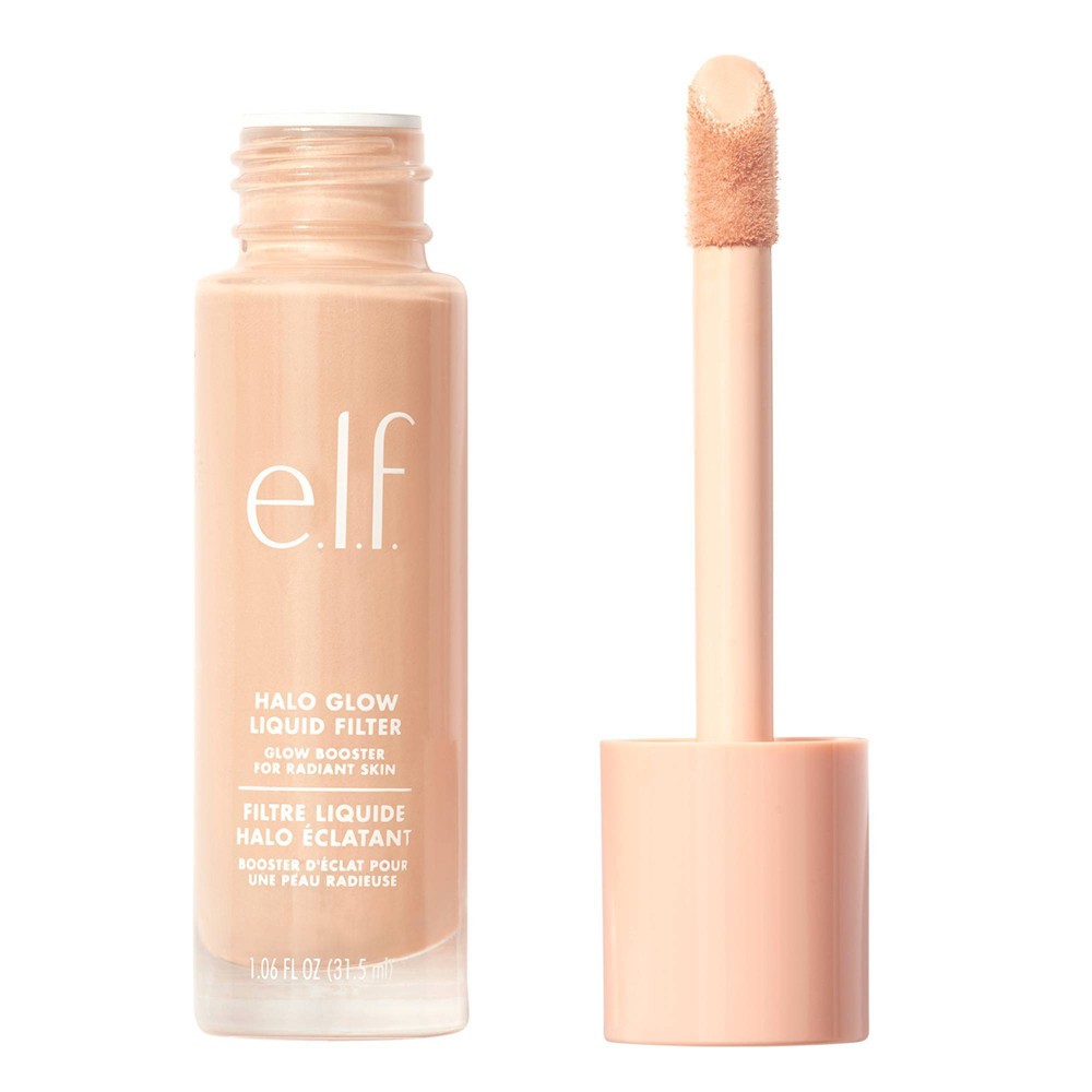 E. L.f. Cosmetics Halo Glow Liquid Filter in a clear glass bottle with a peach-toned liquid, featuring a soft applicator wand and minimalist white branding.
