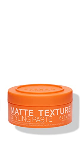 Bright orange round container of Eleven Australia Matte Texture Styling Paste for men, featuring bold white text and a textured lid, 3 oz size.