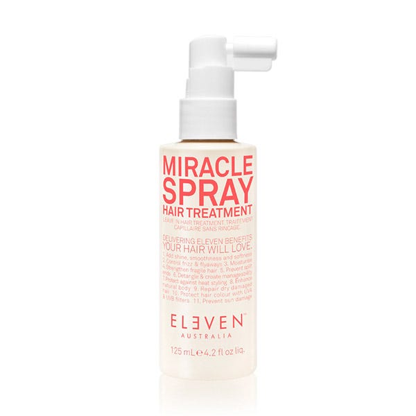 Clear spray bottle with a white cap, featuring bold red text that reads "MIRACLE SPRAY HAIR TREATMENT" and "ELEVEN AUSTRALIA," containing 4.2 oz of product.