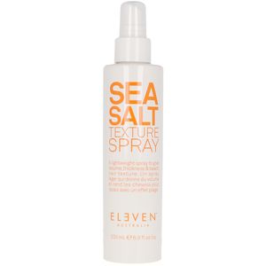 White spray bottle with a pump top, labeled "SEA SALT TEXTURE SPRAY" in bold orange letters, featuring the brand name "ELEVEN AUSTRALIA" in smaller text below.